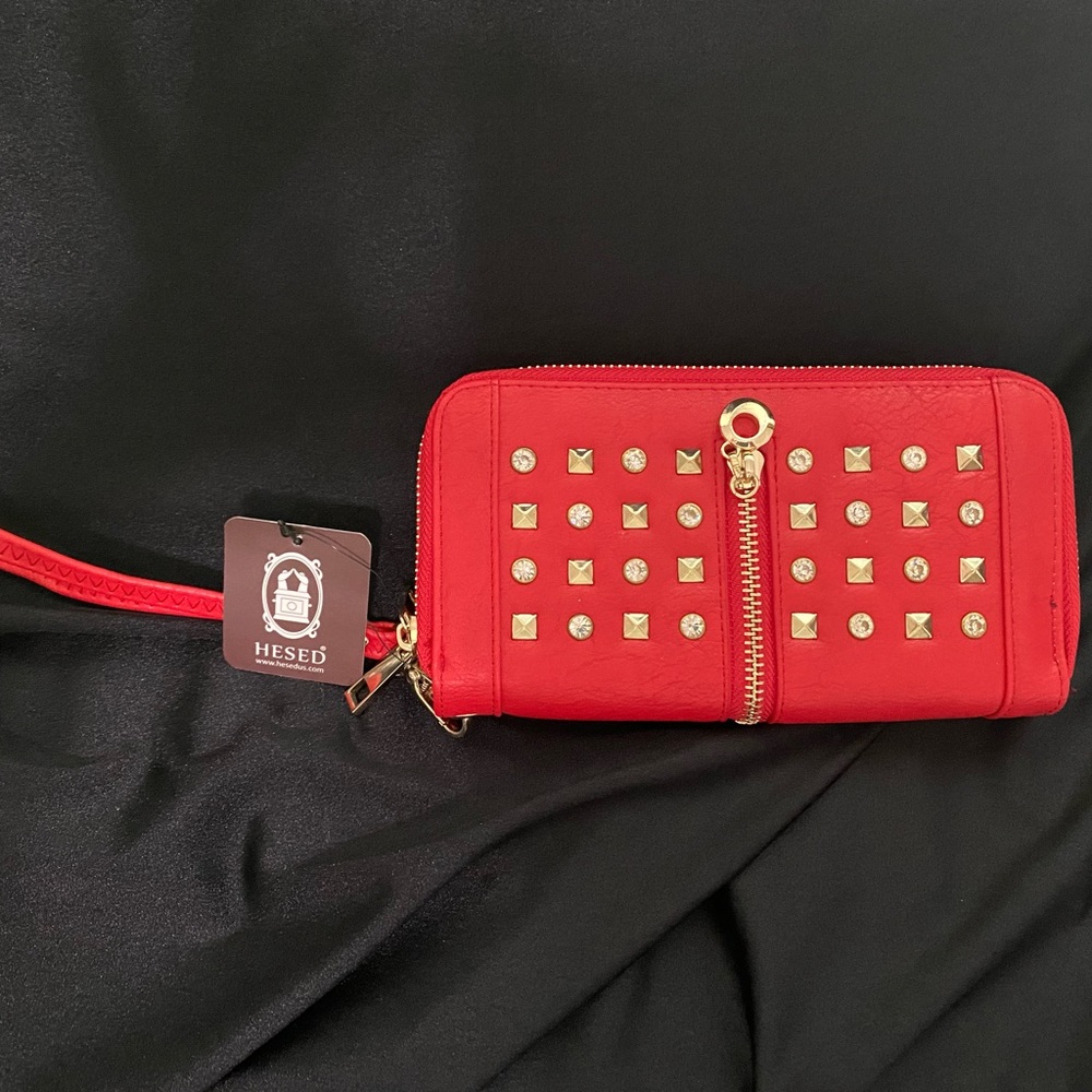 Bright red brand new gold studded wrist purse.